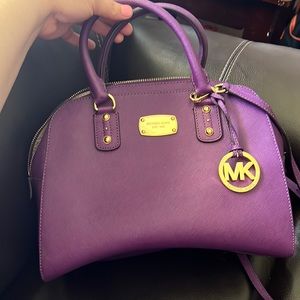 authentic Michael Kors handbag with a crossbody option. Mint condition.